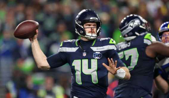 Sam Darnold making a pass in the Superbowl